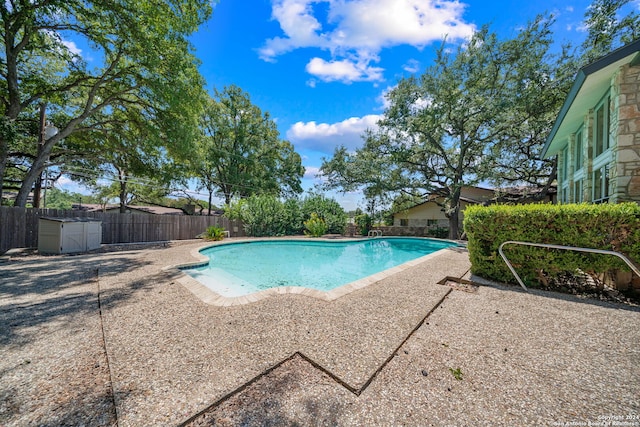 view of swimming pool with a patio area