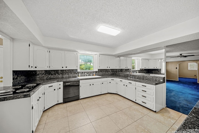 kitchen featuring dishwasher, white cabinets, and light colored carpet