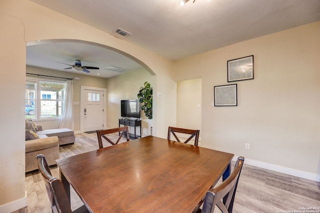 dining space featuring light hardwood / wood-style floors and ceiling fan