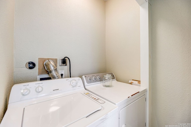 laundry area with washer and clothes dryer, hookup for an electric dryer, and hookup for a washing machine