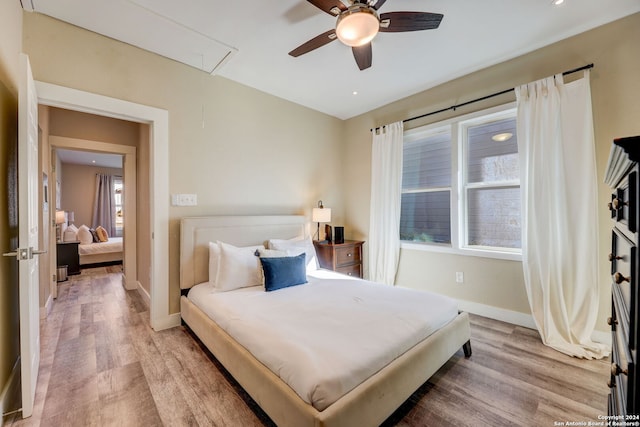 bedroom featuring light hardwood / wood-style flooring and ceiling fan