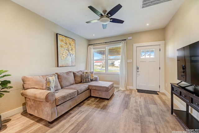 living room with ceiling fan and light hardwood / wood-style floors