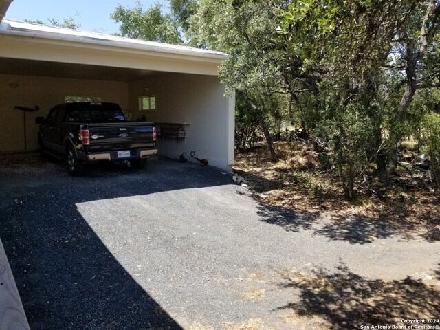 exterior space with a carport