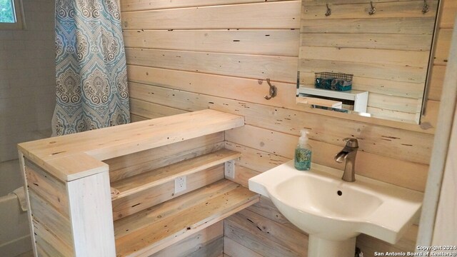 bathroom with wooden walls