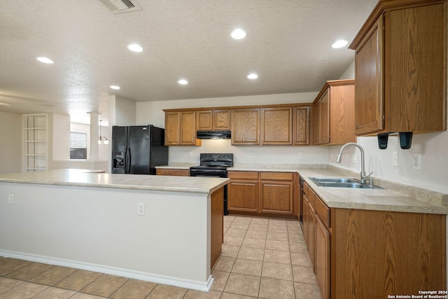 kitchen featuring a kitchen island, a textured ceiling, sink, light tile flooring, and black appliances