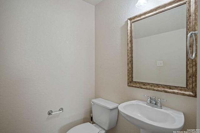 bathroom with sink and toilet