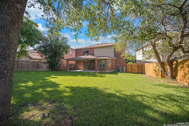 rear view of house with a lawn