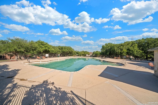 view of pool featuring a patio