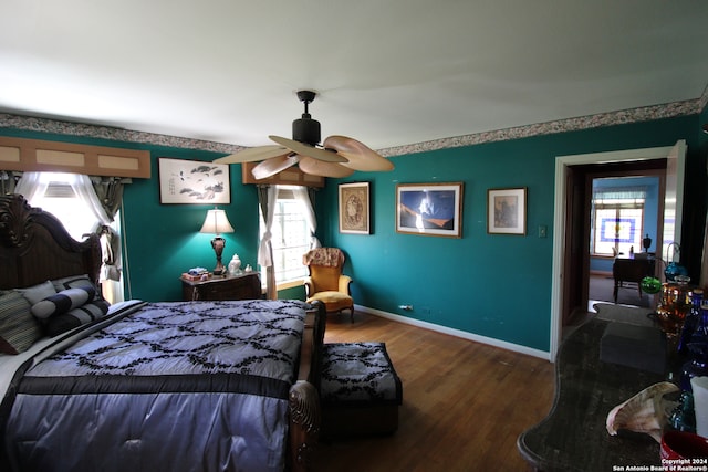 bedroom featuring dark wood-type flooring and ceiling fan