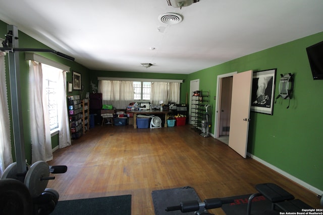 exercise area featuring hardwood / wood-style floors