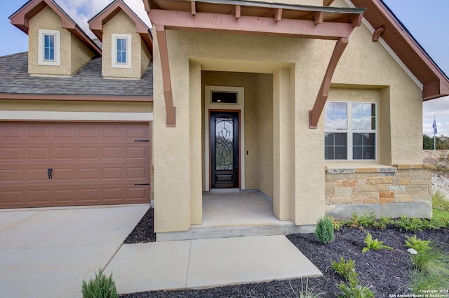 entrance to property featuring a garage