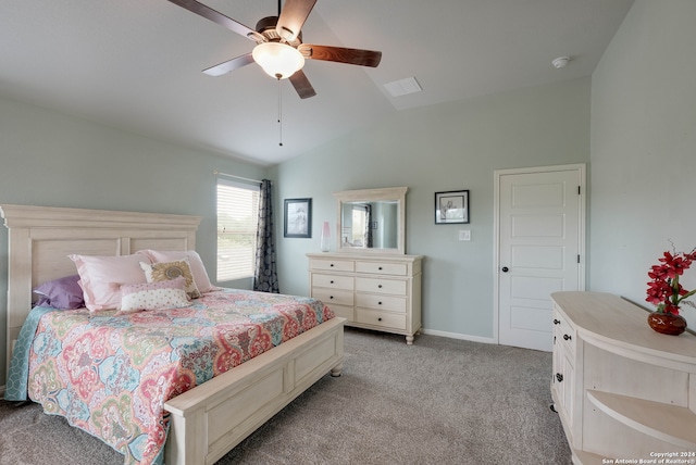 bedroom with lofted ceiling, ceiling fan, and light carpet