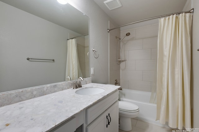 full bathroom with shower / tub combo with curtain, oversized vanity, tile floors, and toilet