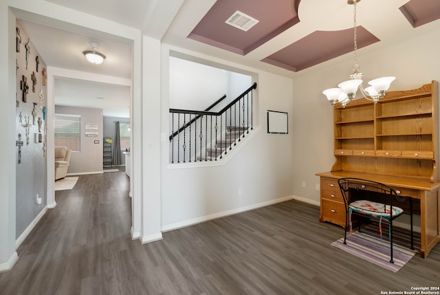 unfurnished office featuring dark wood-type flooring and a notable chandelier