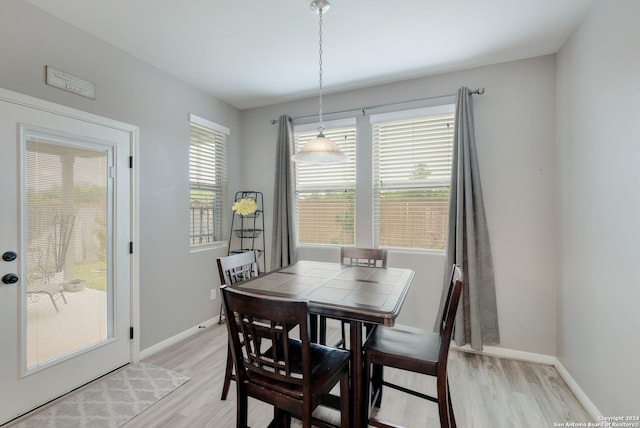 dining space featuring light wood-type flooring