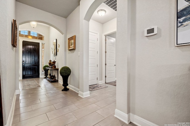 foyer entrance featuring light tile floors