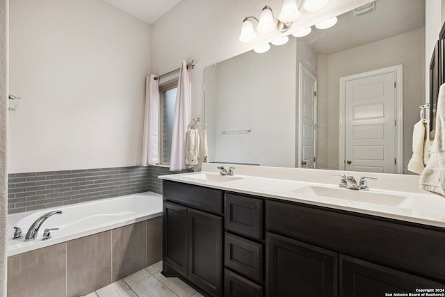 bathroom with large vanity, tile floors, double sink, and tiled tub