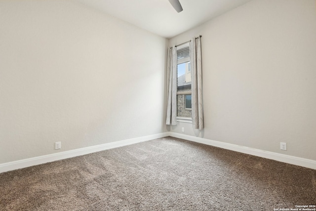 unfurnished room featuring carpet