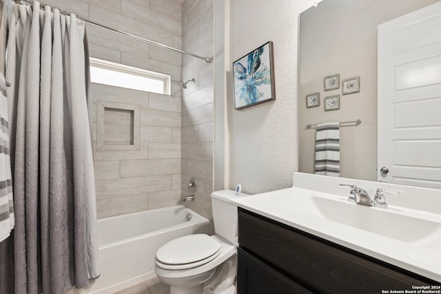 full bathroom with shower / bath combo with shower curtain, toilet, and vanity