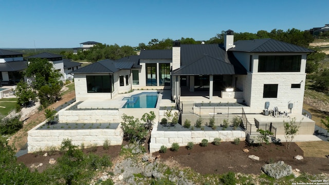 rear view of house with a patio