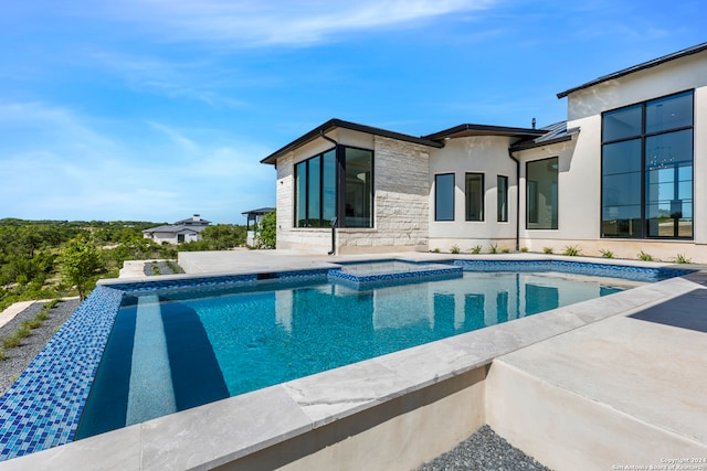 view of swimming pool featuring a patio area