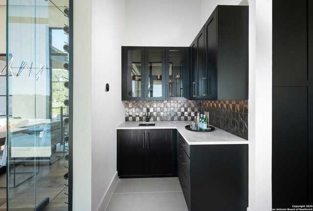 kitchen featuring backsplash and light stone counters