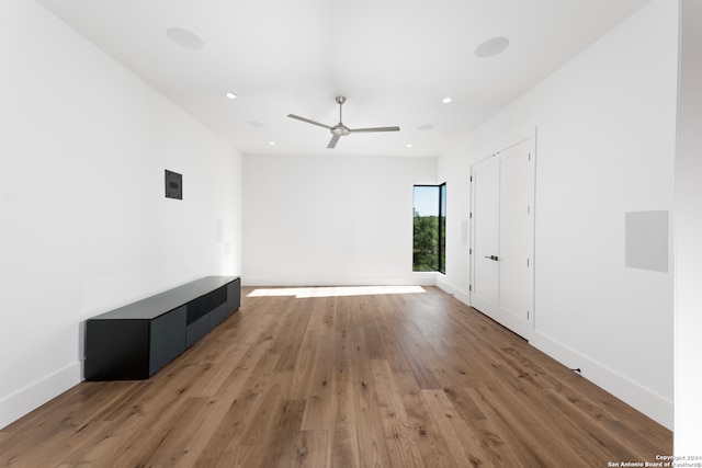 unfurnished living room featuring dark hardwood / wood-style floors and ceiling fan