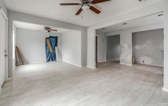 unfurnished room featuring light hardwood / wood-style floors and ceiling fan