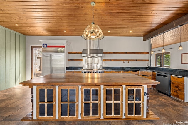 kitchen featuring dark tile floors, appliances with stainless steel finishes, decorative light fixtures, and wooden ceiling