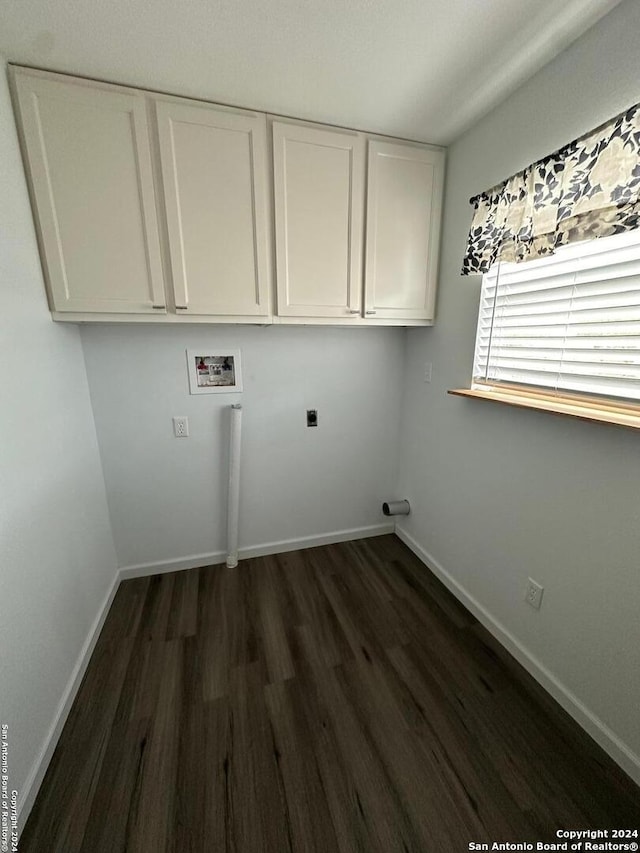 laundry room with cabinets, electric dryer hookup, washer hookup, and dark hardwood / wood-style flooring