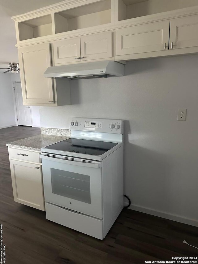 kitchen featuring dark hardwood / wood-style flooring, white cabinets, ceiling fan, and white electric stove