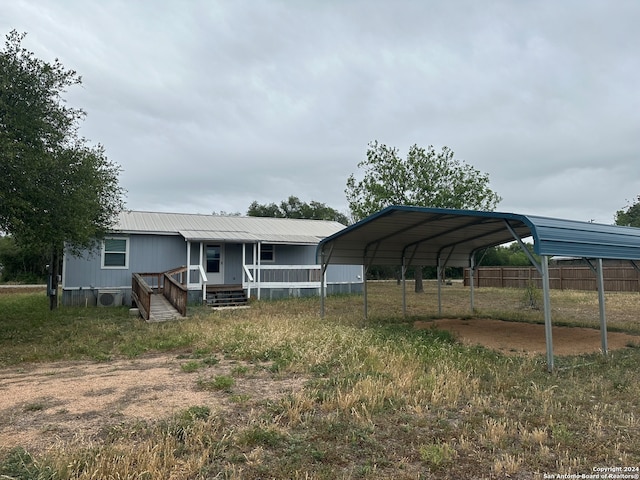 exterior space featuring covered porch and a carport