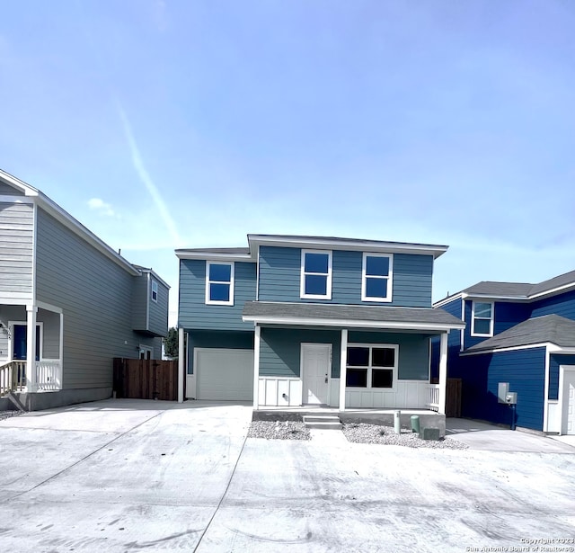 view of front property with a garage and covered porch