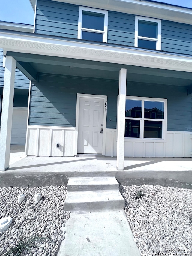 entrance to property with covered porch