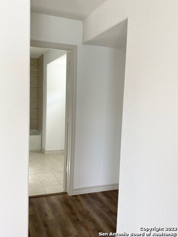 corridor featuring light hardwood / wood-style floors