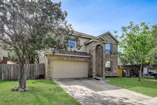 view of front facade with a garage and a front lawn