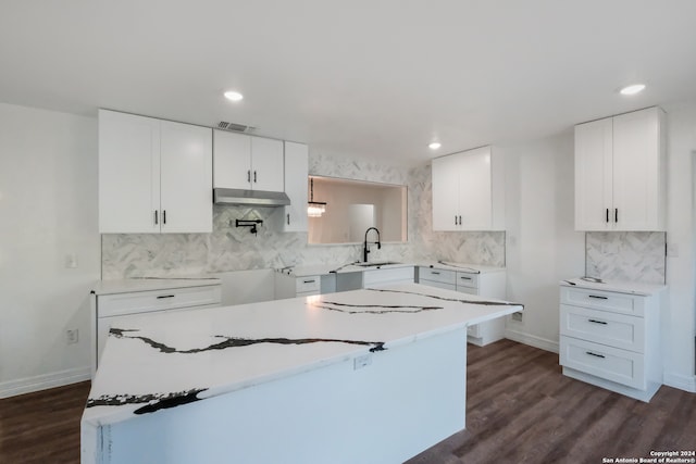 kitchen with dark wood-type flooring and white cabinets