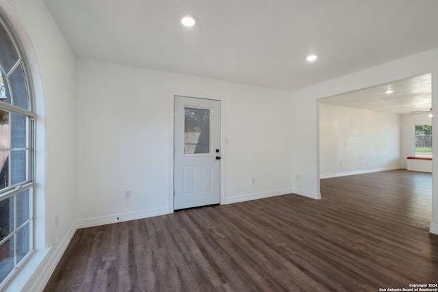 empty room featuring dark hardwood / wood-style floors and ceiling fan