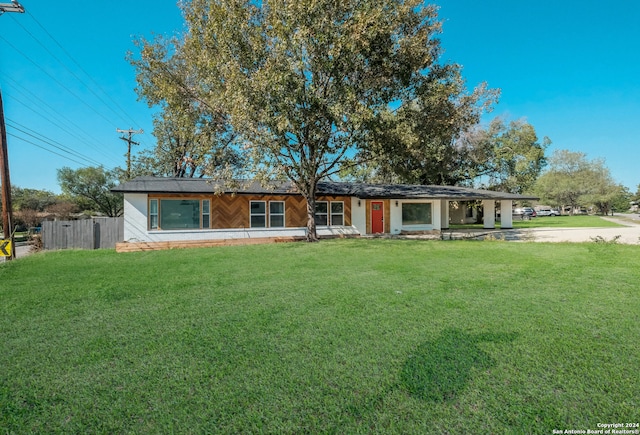 ranch-style home with a front yard