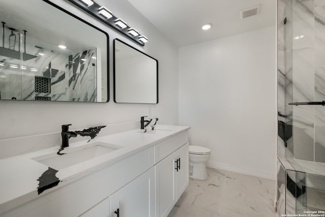 bathroom with tile flooring, double vanity, and toilet