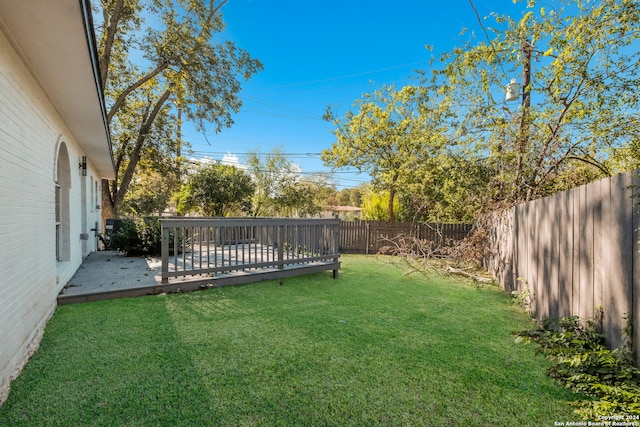 view of yard featuring a wooden deck