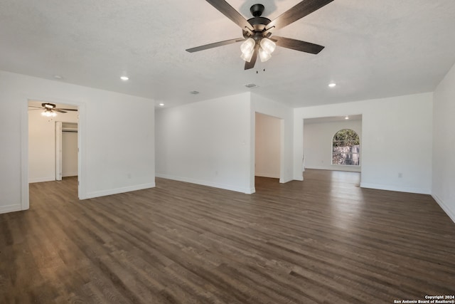 unfurnished room with dark hardwood / wood-style flooring and ceiling fan