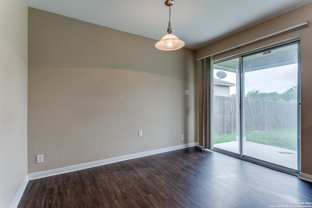 spare room with dark wood-type flooring