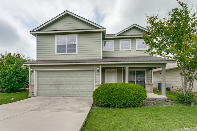 view of front facade with a garage and a front yard