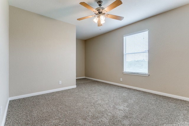 carpeted empty room with ceiling fan