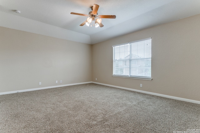 spare room featuring light carpet and ceiling fan