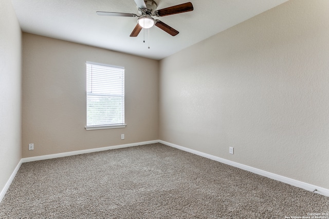 empty room with ceiling fan and carpet floors