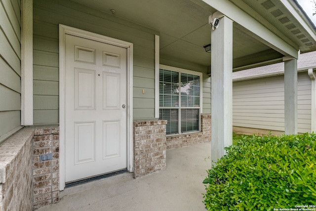 doorway to property featuring a porch