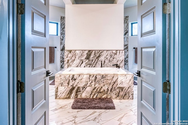 foyer entrance with plenty of natural light and light tile floors