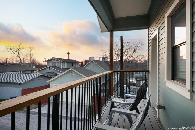 view of balcony at dusk